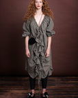 The Amano long line flounce dress has ruffles through the front with raw edging. Ties are used to fasten up and gather neck line and centre front. It has a raglan sleeve, side pockets and french seams throughout. This piece doubles up as a duster jacket. Composition: pure linen Crafted in Melbourne, Australia